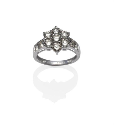 Lot 319 - A Platinum Diamond Cluster Ring, the round brilliant cut diamonds in claw settings, two further...