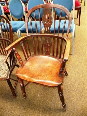 Lot 583 - A 19th century Windsor armchair with crinoline stretcher