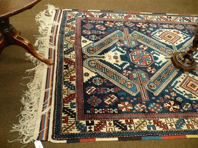 Lot 595 - Seichur design Rug, West Anatolia The indigo field with a column of X shaped crosses surrounded...