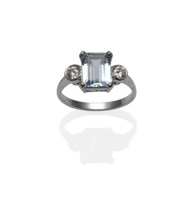 Lot 322 - An Aquamarine and Diamond Ring, an emerald-cut aquamarine in a white four claw setting, flanked...