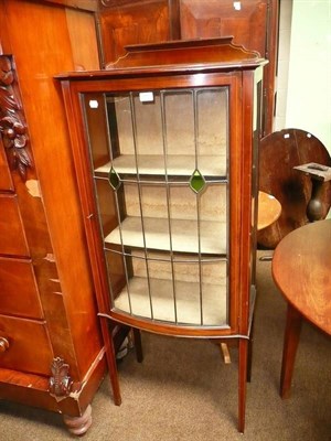 Lot 618 - A mahogany glazed display cabinet with leaded glass door, circa 1900