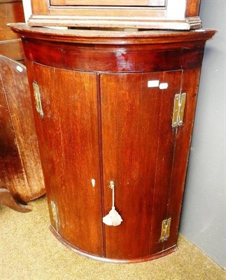 Lot 626 - George III oak/mahogany corner cupboard