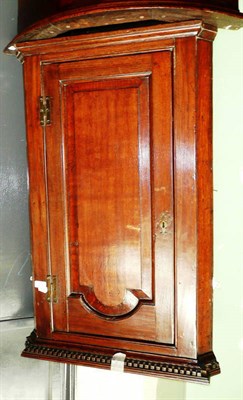 Lot 627 - George II oak corner cupboard