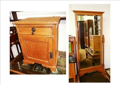 Lot 632 - Oak cheval mirror and a pair of oak bedside cabinets