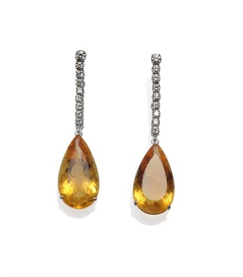 Lot 325 - A Pair of 18 Carat White Gold Citrine and Diamond Drop Earrings, a row of round brilliant cut...