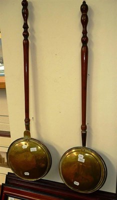 Lot 649 - Two brass and copper warming pans