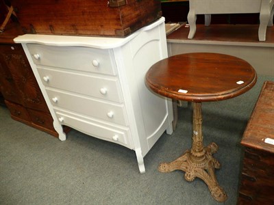 Lot 712 - Small circular pub table and a white four drawer chest