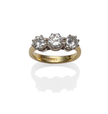 Lot 334 - An 18 Carat Gold Diamond Three Stone Ring, the round brilliant cut diamonds in a white claw setting