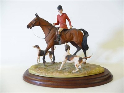 Lot 1012 - Border Fine Arts 'Moving Off' mounted huntsman with two hounds, model No. L36 by David Geenty, Ltd.