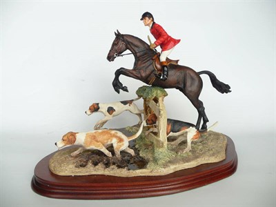 Lot 1022 - Border Fine Arts 'Hulloa Away' huntsman on bay horse with three hounds, model No. L104 by Anne...