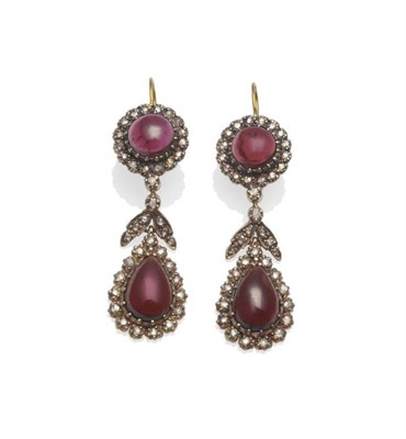 Lot 341 - A Pair of Garnet and Diamond Earrings, a round cabochon garnet within a border of rose cut diamonds