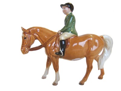 Lot 1117 - Beswick Boy on Palomino Pony, model No. 1500, rider in green jacket looking ahead, gloss, 14cm high