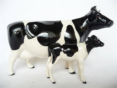 Lot 1126 - Beswick Friesian Cow Ch. 'Claybury Leegwater', model No. 1362A, 11.9cm high and Friesian Calf,...