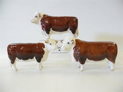 Lot 1129 - Beswick Hereford Bull, model No. 1363, 10.8cm high Another Hereford Bull and a Hereford Cow,...