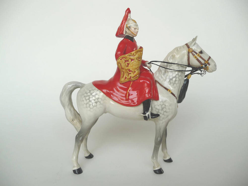 Lot 1149 - Beswick Lifeguard style one with trumpet, model No. 1624, grey horse, gloss, 24cm high (af)