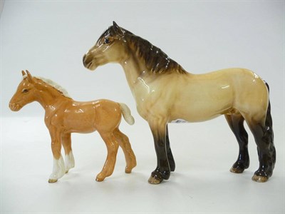 Lot 1151 - Beswick  Palomino Shire Foal, model No. 1053, gloss, 12.5cm high and a Highland Pony...