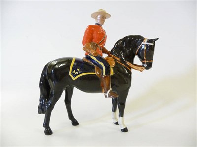 Lot 1175 - Beswick Canadian Mountie on black horse, model No. 1375, 21cm high (restoration to hoof)