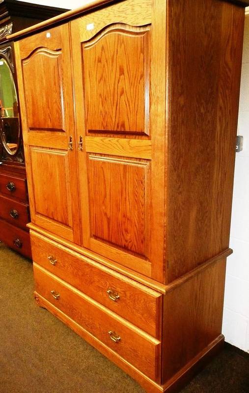 Lot 518 A gentleman's oak double wardrobe by Royal