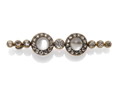 Lot 354 - A Moonstone and Diamond Brooch, the bar brooch with two clusters of cabochon moonstones within...