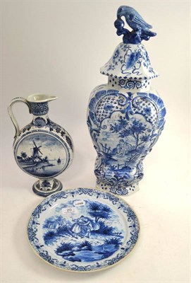 Lot 20 - A Dutch Delft vase and cover, a Delft plate and a jug (3)