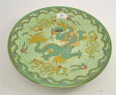 Lot 29 - A Crown Ducal Charlotte Rhead charger, decorated in the Manchu pattern, on a green ground,...