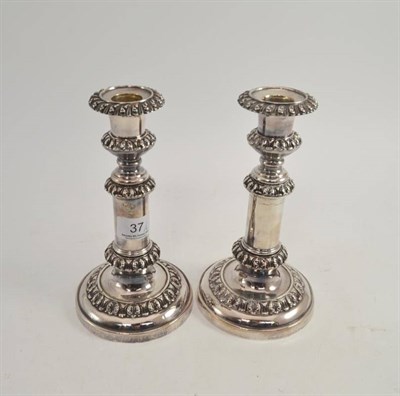 Lot 37 - A pair of plated telescopic candlesticks