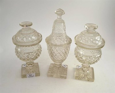 Lot 41 - A pair of cut glass vases with covers and a single glass vase and cover