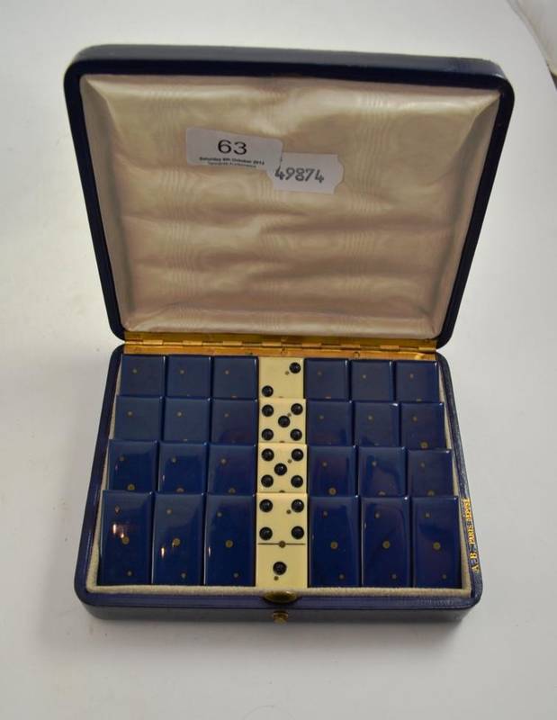 Lot 63 - A set of dominoes in blue leather case marked A.B. PARIS DEPOSE