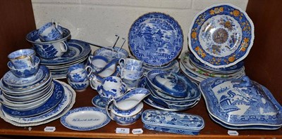 Lot 79 - Shelf of assorted blue and white pottery including Willow pattern, Spode etc