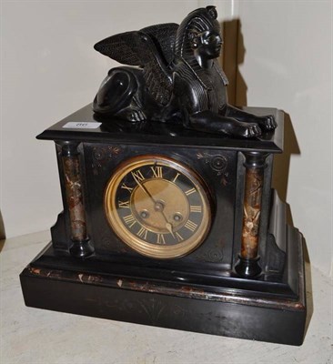 Lot 86 - A black slate striking mantel clock surmounted by a sphinx