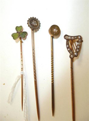 Lot 103 - Four assorted stick pins