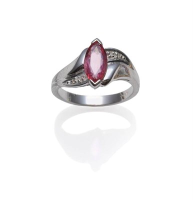 Lot 364 - An 18 Carat White Gold Padparadscha Ring, a marquise cut sapphire in a twist setting, with diamonds