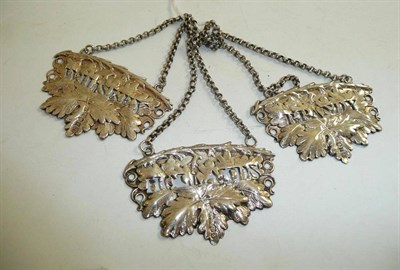 Lot 122 - Three silver leaf embossed decanter labels for Brandy, Hollands and Whisky