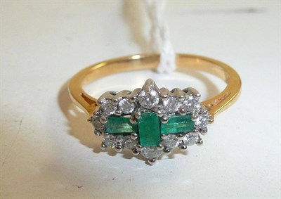 Lot 126 - Emerald and diamond cluster style ring
