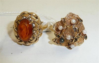 Lot 127 - A 9ct gold citrine ring and a cultured pearl ring stamped '9ct'