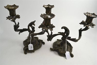 Lot 148 - A pair of bronze Rococo scrolling candelabra