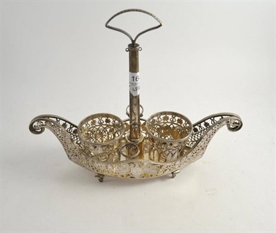 Lot 164 - A white metal boat shaped bottle stand
