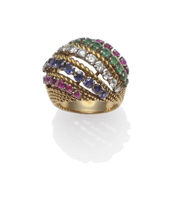 Lot 370 - An 18 Carat Gold Multi-Gemstone Ring, by Kutchinsky, rows of round cut rubies, emeralds and...