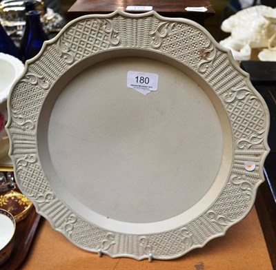 Lot 180 - A salt glaze stoneware large plate