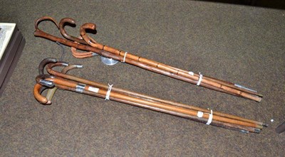 Lot 186 - Ten walking sticks, some with silver mounts and one shooting stick and four boxed Cash's...