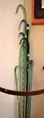 Lot 214 - A collection of eleven 19th century green glass walking sticks