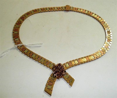 Lot 219 - A 9ct gold ruby-set, three colour necklace