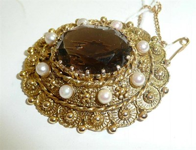 Lot 244 - A 9ct gold smoky quartz and cultured pearl brooch/pendant