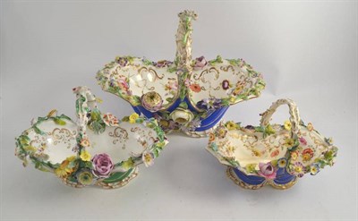 Lot 249 - A Coalport flower-encrusted basket with periwinkle blue ground, a similar smaller basket and...