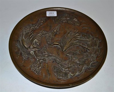 Lot 263 - A Japanese Meiji period bronze plate, circa 1880, decorated with chisel carved courting cranes,...