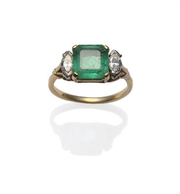 Lot 380 - An Emerald and Diamond Three Stone Ring, the square step cut emerald in a yellow claw setting...