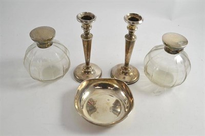 Lot 283 - A pair of silver mounted glass bottles, a pair of small silver candlesticks and a silver dish