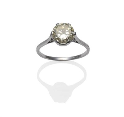 Lot 389 - A Diamond Solitaire Ring, the round brilliant cut diamond in a white six claw setting, on a...