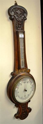 Lot 389 - An aneroid barometer and a chiming Smiths clock