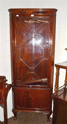 Lot 400 - A reproduction glazed mahogany standing corner cupboard